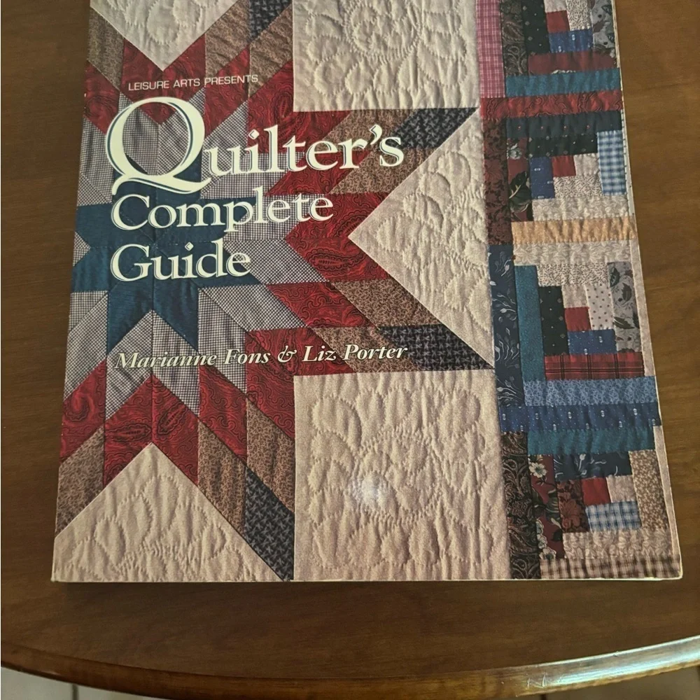 Red and Blue Log Cabin Quilt with Intricate Stitching